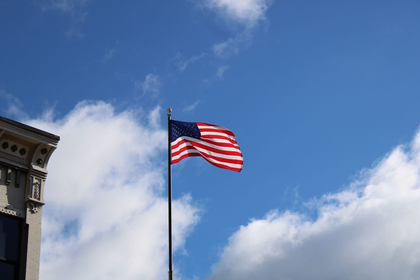 American flag flying against a blue sky